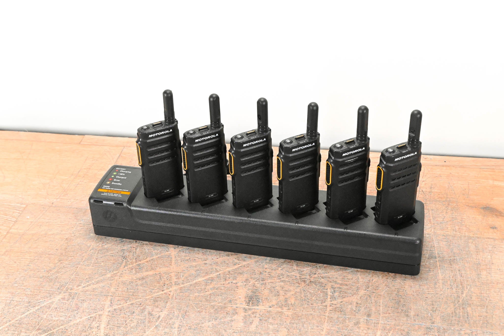 Motorola PMLN7093A Multi-Unit Charger with six SL300 Two-Way Radios