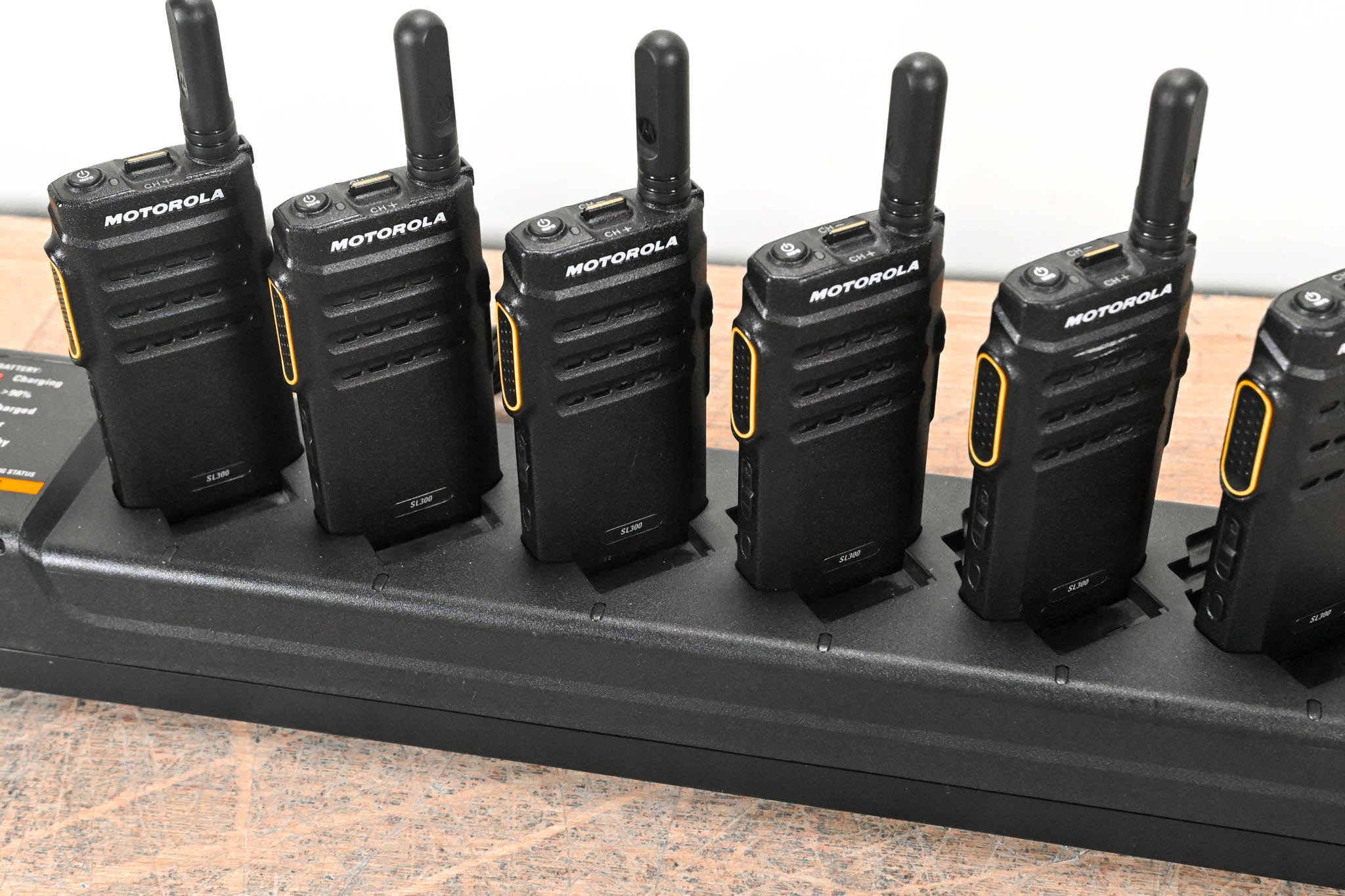 Motorola PMLN7093A Multi-Unit Charger with six SL300 Two-Way Radios