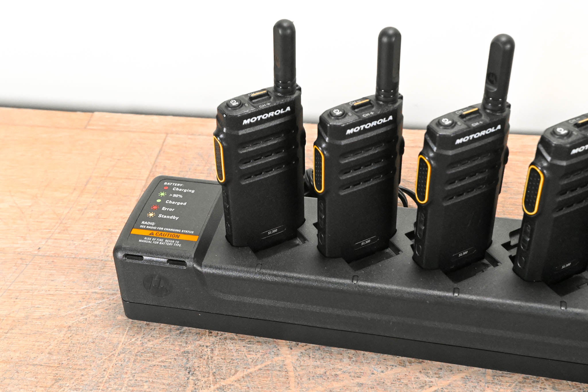 Motorola PMLN7093A Multi-Unit Charger with six SL300 Two-Way Radios