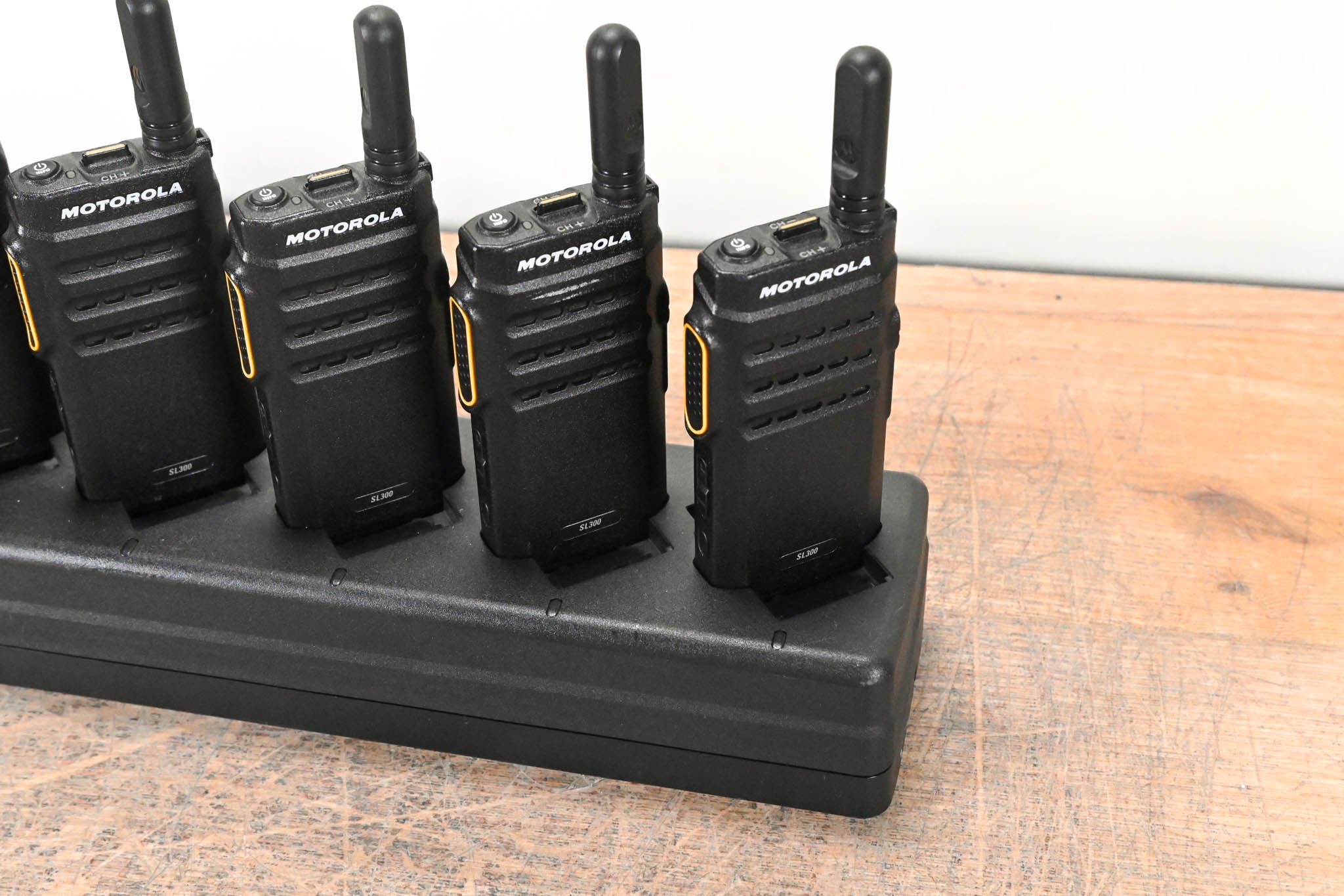 Motorola PMLN7093A Multi-Unit Charger with six SL300 Two-Way Radios